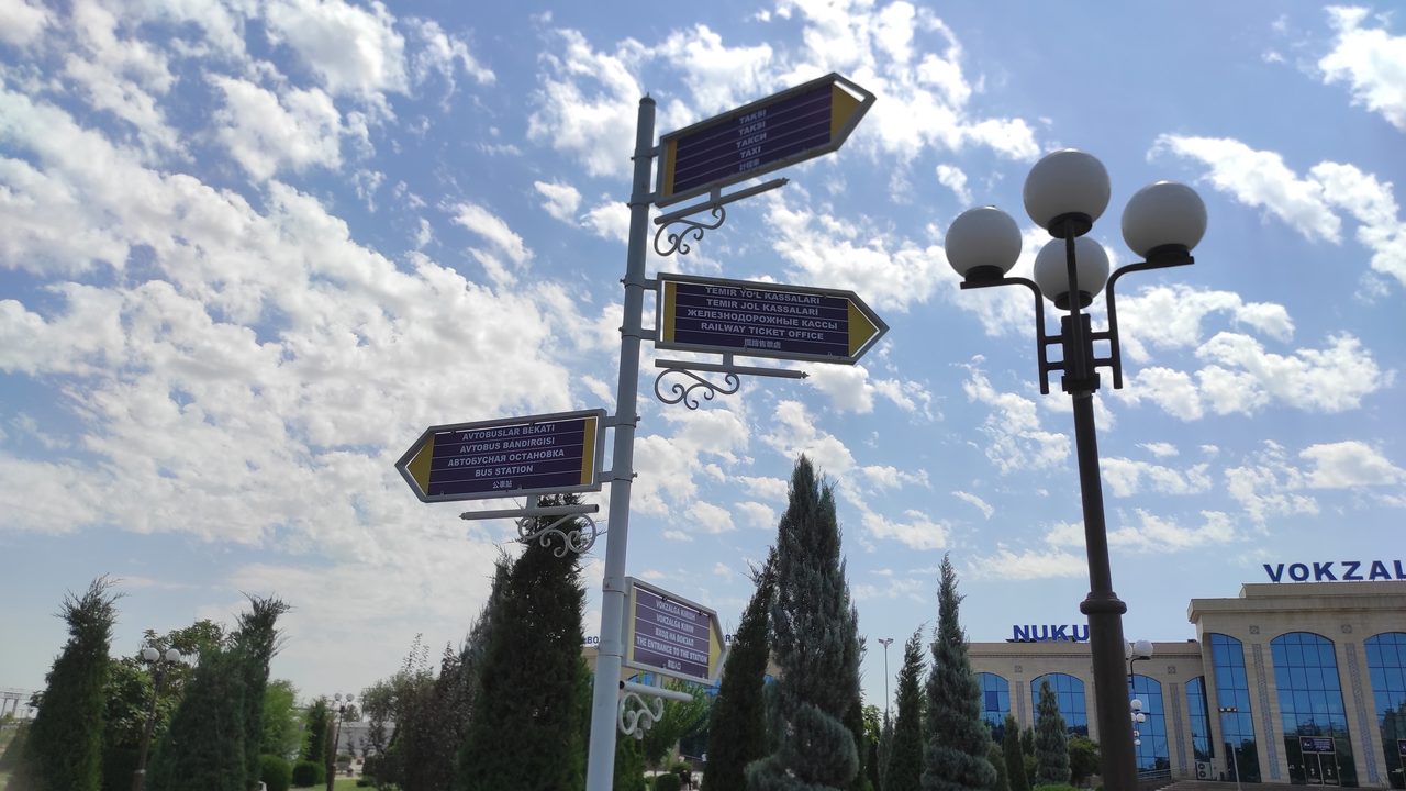 Station sign and platform at Nukus railway station, Karakalpakstan