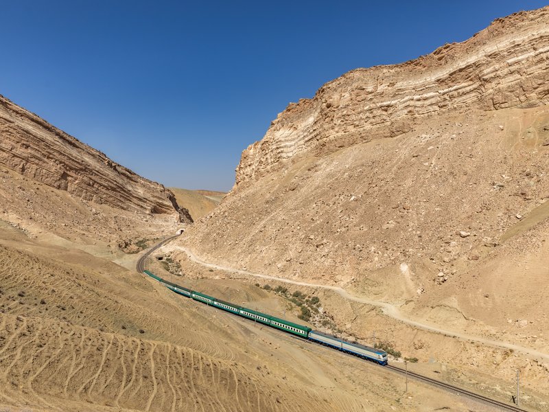 Uzbekistan Railways conventional train on the Fergana Valley rail corridor near the Kamchik crossing