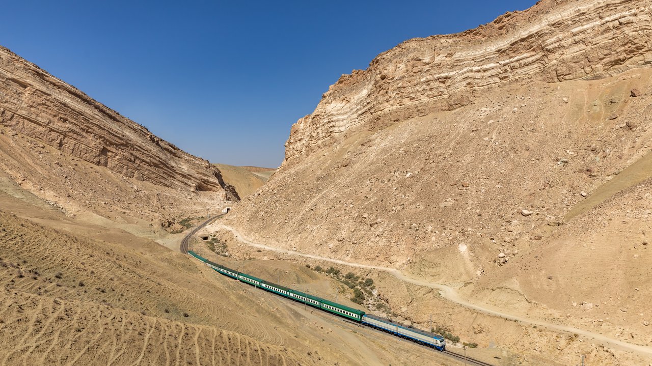 Uzbekistan Railways conventional train on the Fergana Valley rail corridor near the Kamchik crossing