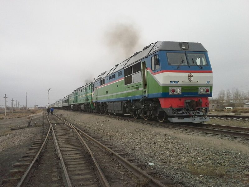 Conventional Uzbekistan Railways locomotive and passenger carriages