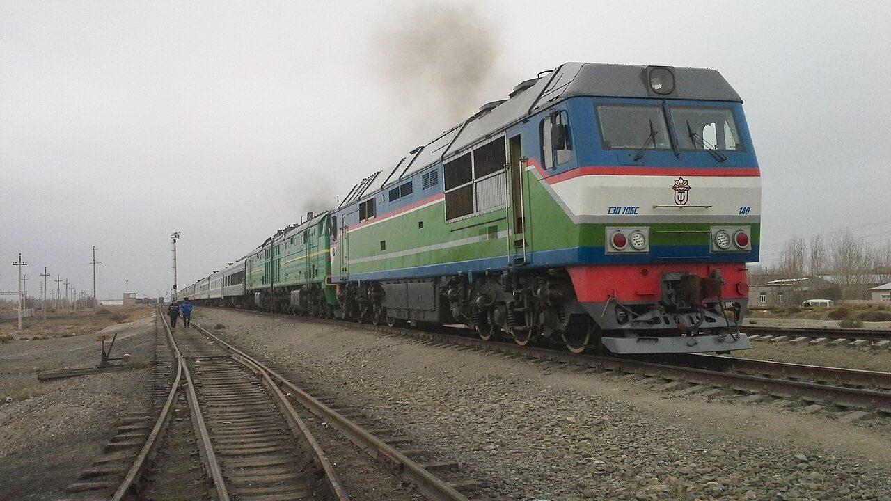 Conventional Uzbekistan Railways locomotive and passenger carriages
